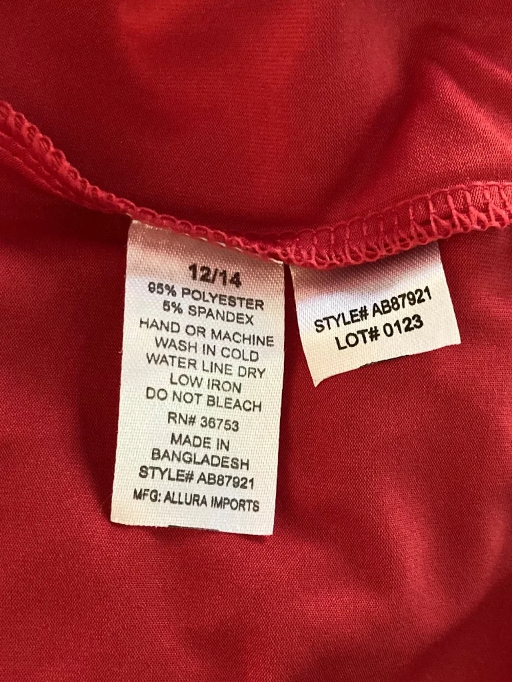 Boy’s size 12/14 Quad Seven long sleeved red swim shirt/rash guard